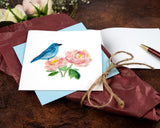 Quilled Bluebird & Peonies Greeting Card with light blue envelope on top of flower bouquet with card insert and red pen