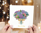 Quilled Hydrangea Bouquet Birthday Card held in hands in front of confetti and candles