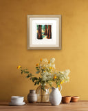 Quilled Redwood Trees Greeting Card in golden frame on hanging on yellow wall above table with flowers