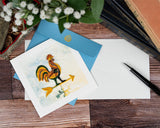 quilled rooster weathervane greeting card with blue envelope next to card insert with pen, books, and flowers on wooden background