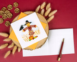 Quilled Scarecrow Greeting Card with orange envelope surrounded by florals and gold wax seals