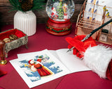 Quilled Vintage Santa Christmas Card on desk with card insert being handwritten by santa