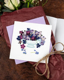Quilled Violet Bouquet Greeting Card with lilac envelope on top of flower bouquet
