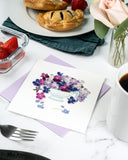 Quilled Violet Bouquet Greeting Card with lilac envelope on table with breakfast, coffee, fruit, hand pies, and flowers