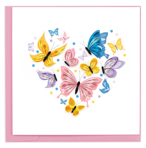 blank quilled greeting card of blue, yellow and pink butterflies forming a heart