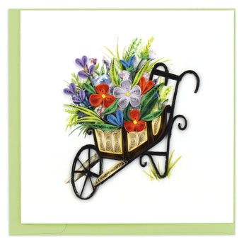 Quilled blank greeting card with a brown wheelbarrow filled with flowers.