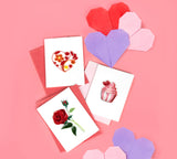 Quilled Rose Gift Enclosure Mini Card next to Quilled Cupcake Mini Card and Quilled Heart Mini Card on pink background with paper hearts