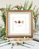 Quilled Birthday Cupcake Trio Greeting Card  in gold frame in front of florals and white background
