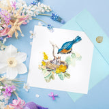  Quilled Bluebird & Babies Greeting Card with blue envelope on blue background next to flowers