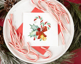 Quilled Candy Canes Christmas Card on white platter with candy canes surrounded by wreath and pine cones