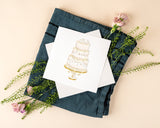 Quilled Elegant Wedding Cake Greeting Card on folded teal napkin with flowers