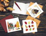 Quilled Fall Foliage Leaves Greeting Card next to cabin quilled greeting card and turkey quilled greeting card with open insert next to leaves and acorns