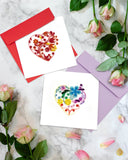 Quilled Floral Rainbow Heart Greeting Card on marble tapletop next to roses and rose petals