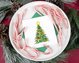 Quilled Gold Garland Christmas Tree Greeting Card with green envelope on white platter surrounded by candy canes on red table with christmas wreath