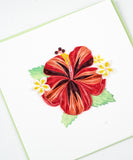 Quilled Hibiscus greeting card laying flat on a white background.