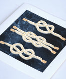 Quilled Nautical Knots Greeting Card laying flat on a white background.