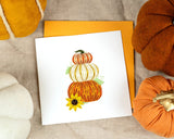 Quilled Stacked Pumpkins Greeting Card next to pumpkin decor