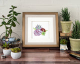 Quilled Vibrant Succulents Greeting Card in gold frame next to flowers