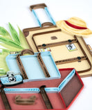 close up detail of quilled vintage luggage greeting card