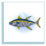 A tuna fish with a gray underbelly, blue top and yellow fins.