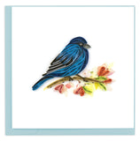 Blank greeting card of a quilled indigo bunting in profile on a flowery branch.