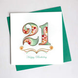 A quilled number twenty one in beautiful colors of green and red, and reads Happy Birthday underneath.