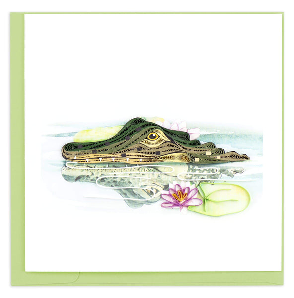 Blank Quilled greeting card of an alligator's nose and eyes above the water next to a Lilly pad