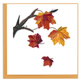 Blank greeting card featuring a quilled design of autumn leaves falling from a tree branch