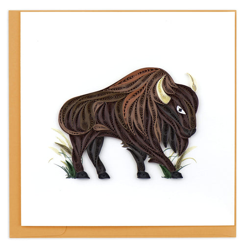 greeting card featuring a quilled brown bison standing in some patches of grass