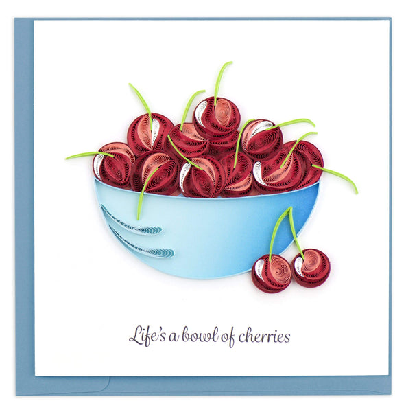 Quilled card showing a blue bowl filled with red cherries. 