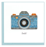 Blank quilled card of a blue, gray and orange camera.