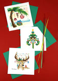 Stylized shot of three quilled Christmas cards on a red background.