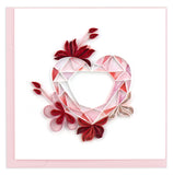Pink quilled heart with red flowers