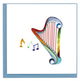 Blank greeting card with a quilled rainbow harp with musical notes emerging from its strings