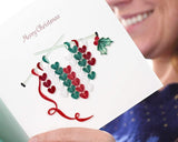 Person reading Quilled Knit Heart Christmas Card
