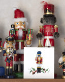 Quilled Nutcracker Christmas Card displayed with a collection of Nutcrackers