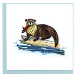 Blank greeting card featuring a Quilled Otter on a log in the water grasping a red fish.