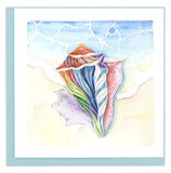 Blank Quilled card of a rainbow colored shell on a beach