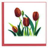 A blank greeting card with four quilled red tulips