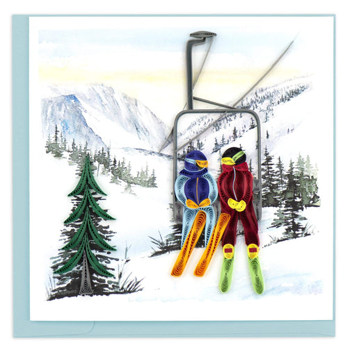 Blank Quilled card of two skiers sitting on a lift chair as they go up the mountain. 