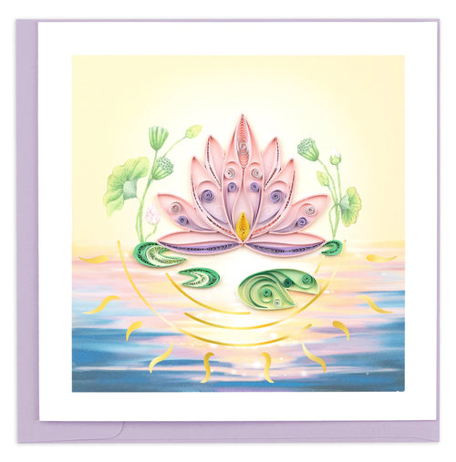 A pink lotus flower sits on the top of the water among lily pads with a sunset reflecting its rays below. Branching lotus leaves encircle the main flower.
