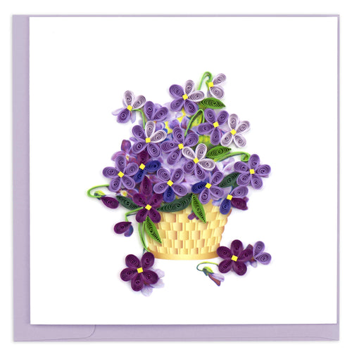 A beautiful bunch of purple violets in a yellow basket.