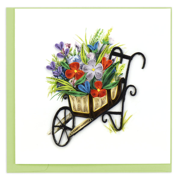 Quilled blank greeting card with a brown wheelbarrow filled with flowers.