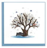 Blank Greeting card of a quilled winter tree in the middle of a snow fall.