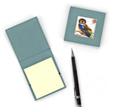 Two sticky note pad covers showing one closed and one open with note pad inside