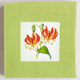 Sticky note pad cover featuring a quilled design of two tiger lily flowers
