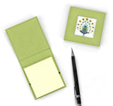 Two sticky note pad covers showing one  closed and one open with note pad inside